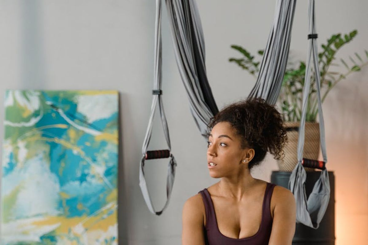 Serene yoga studio atmosphere with soft natural light.